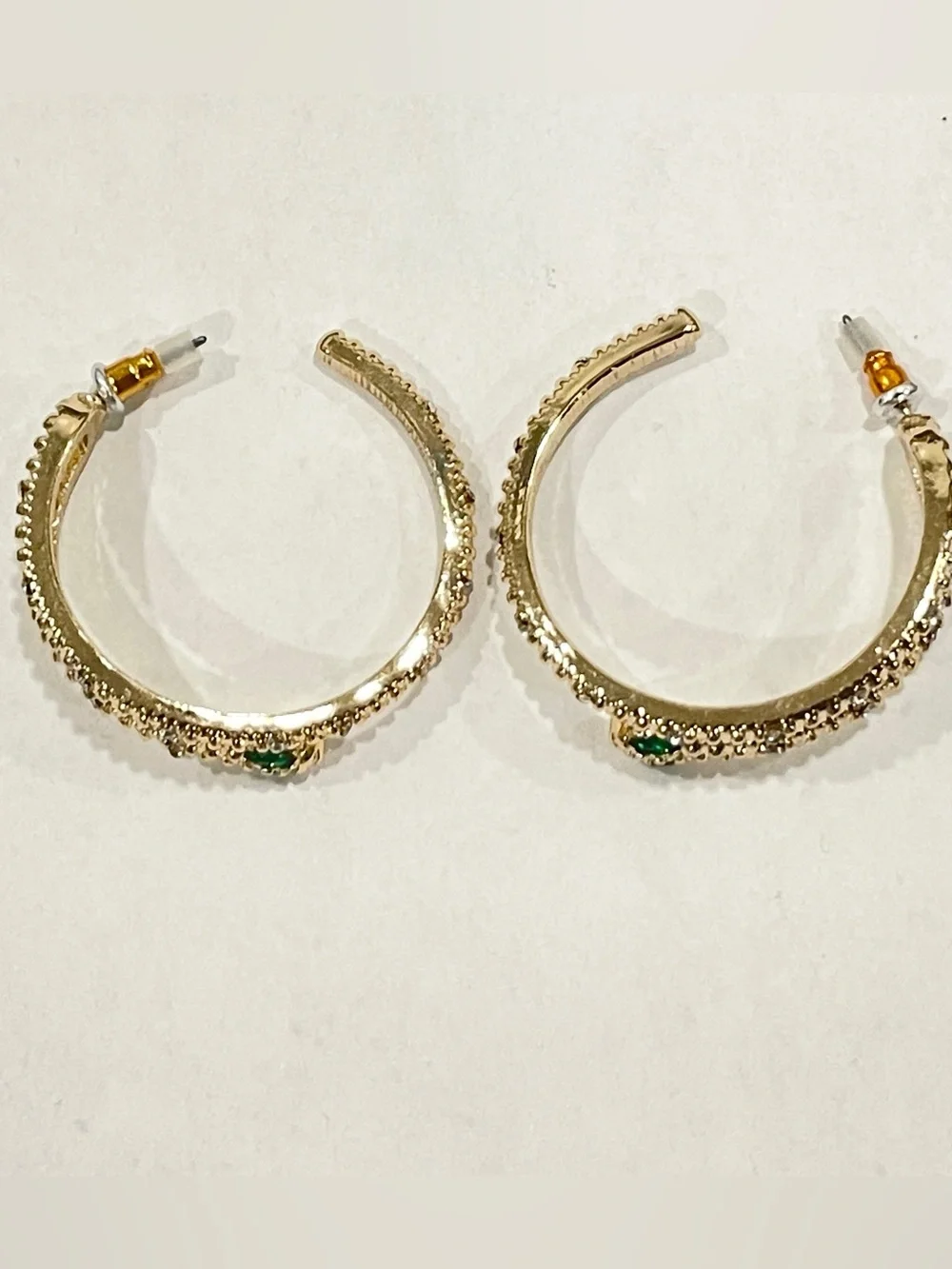Gold Sparkle Snake Hoop Earrings with Green Eye Stone Accents